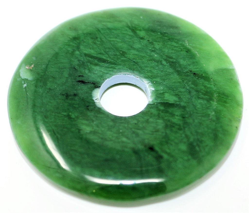 Deep green Nephrite Jade, made by hand into a donut shape