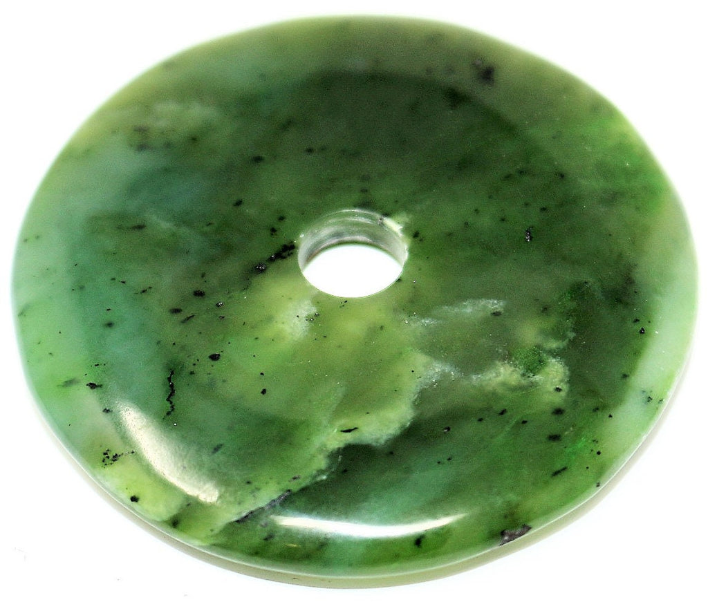 Deep green Nephrite Jade, made by hand into a donut shape