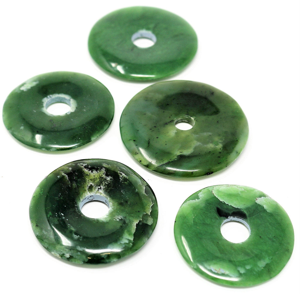 Deep green Nephrite Jade, made by hand into a donut shape